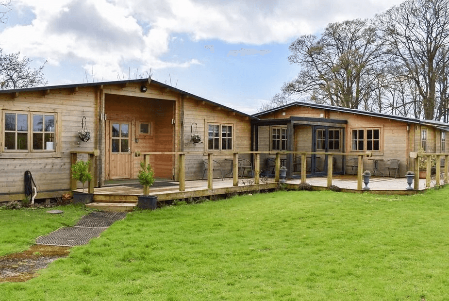 Pineville log cabin exterior in Kent