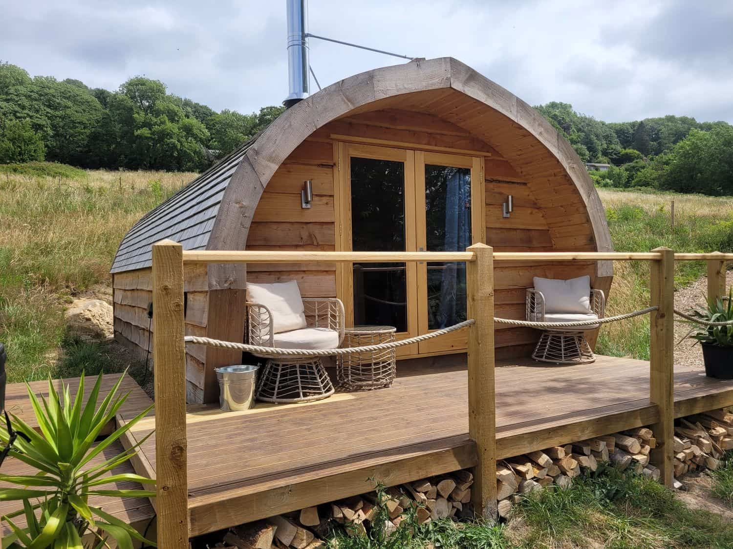 Holbein cedar glamping pod with curved roof perched on hillside overlooking Derwent Valley