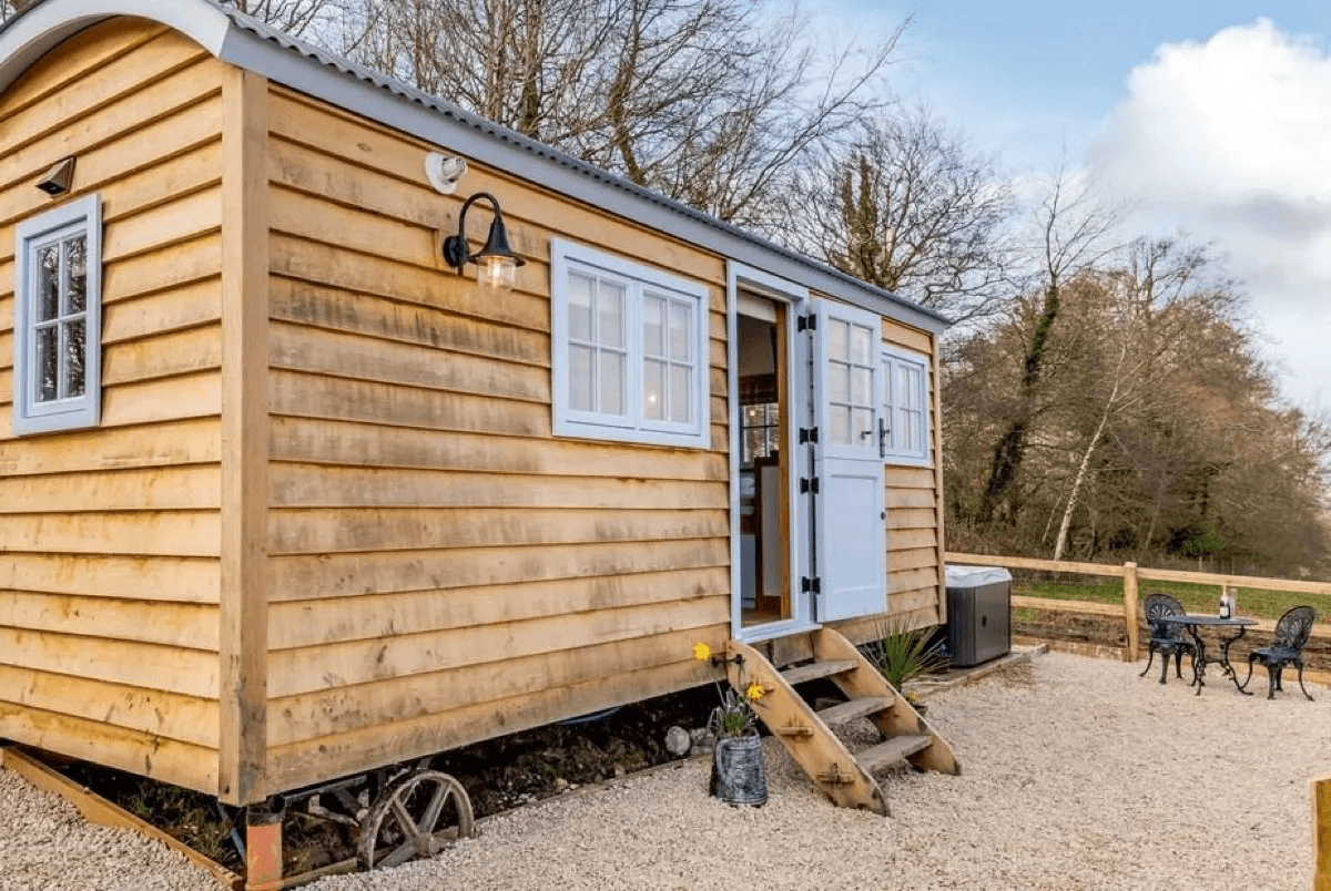 Stylishly furnished interior with woodburner at Spire View Hut