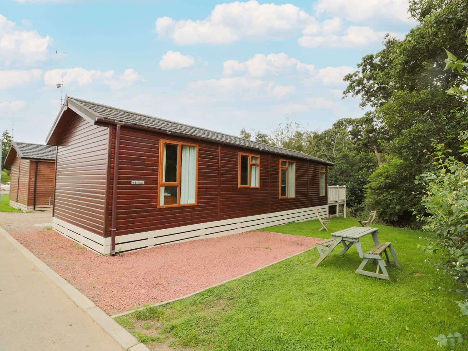 Number 43 Burnside Lodge with enclosed deck by the stream at Bockenfield