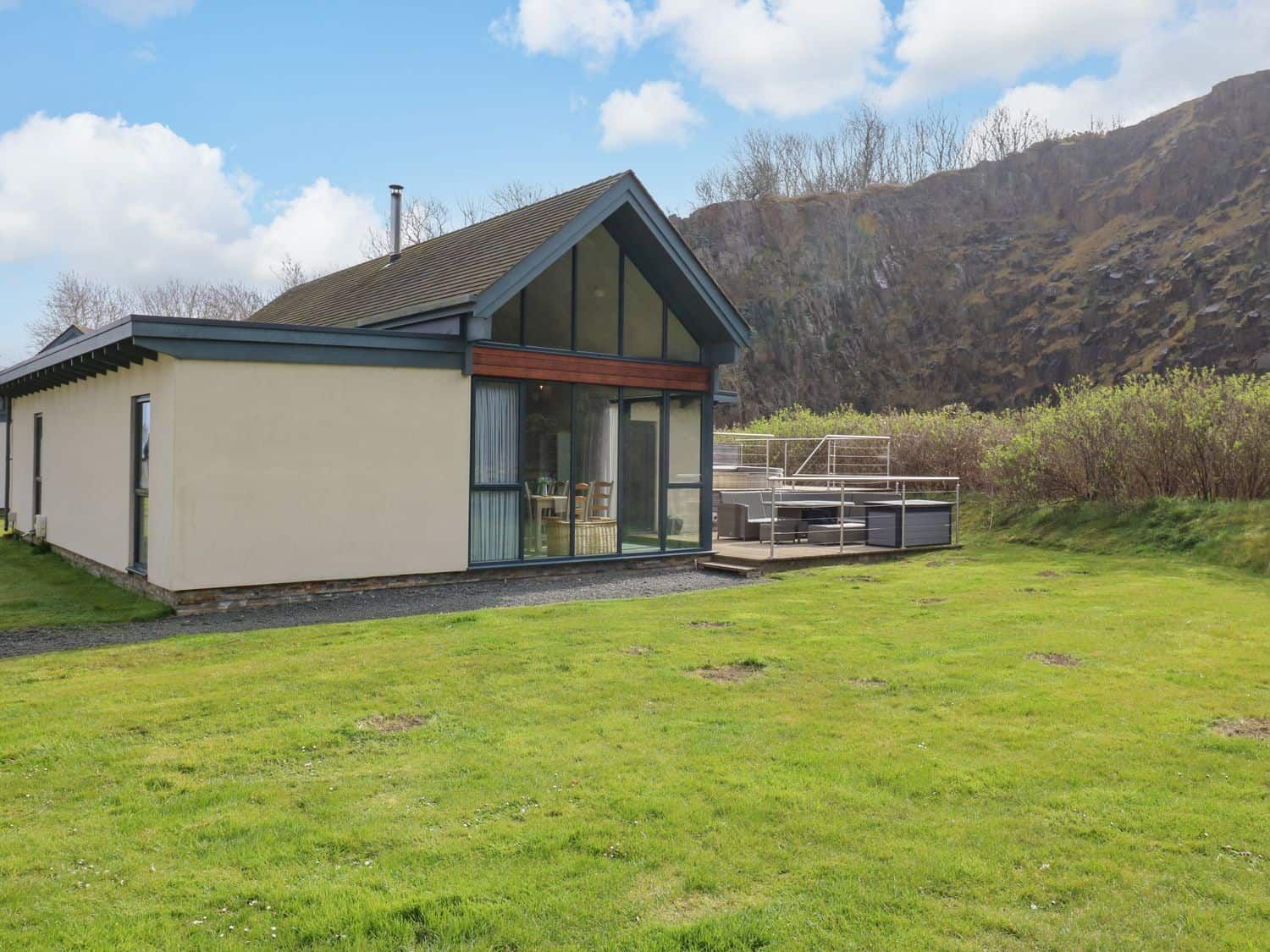 Restharrow Lodge contemporary cabin with wraparound deck near Bamburgh Castle